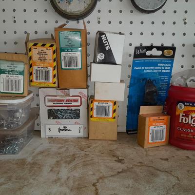 Boxes, and cans full of home hardware - bolts, nuts, nails, and more