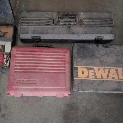 Assortment of drill accessories and empty tool cases