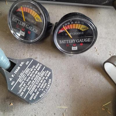 Assortment of gauges, a timing light, and a older battery charger