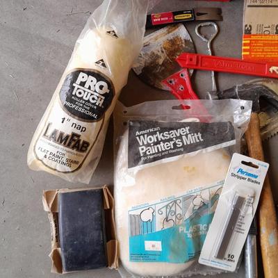 Assortment of painting and drywall tools and hardware