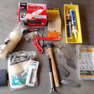 Assortment of painting and drywall tools and hardware