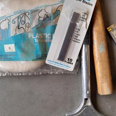 Assortment of painting and drywall tools and hardware