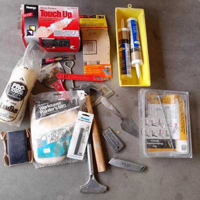Assortment of painting and drywall tools and hardware