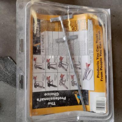 Assortment of painting and drywall tools and hardware