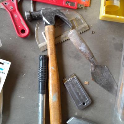 Assortment of painting and drywall tools and hardware