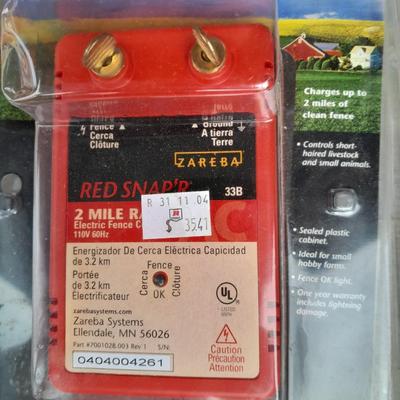 Red snapper electric fence charger with hardware
