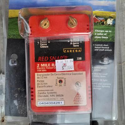 Red snapper electric fence charger with hardware