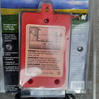 Red snapper electric fence charger with hardware