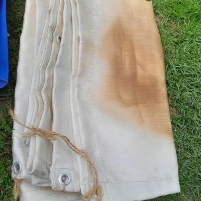 Two chair umbrellas, and a cloth tarp