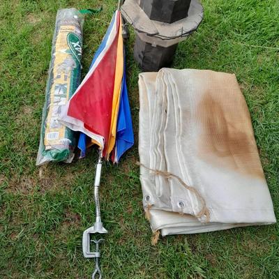 Two chair umbrellas, and a cloth tarp