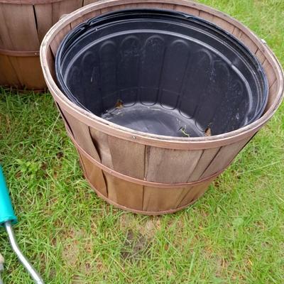 Three flowerpots a small hand shovel, weed puller and rake