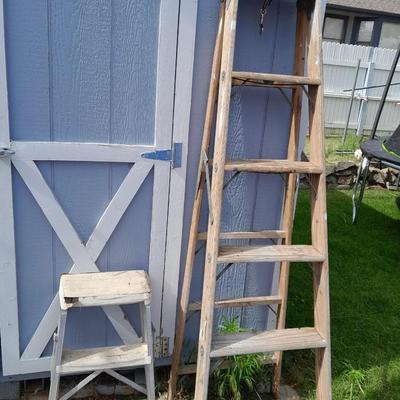 Two ladders, one wooden one smaller metal