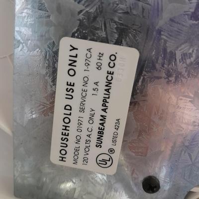 Electronic Sunbeam Mixmaster with two sets of beaters and a mixing bowl