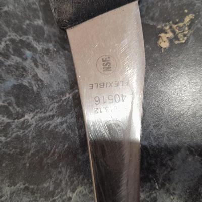 Charcoal Companion stainless steel grilling tool set and several filet knives.