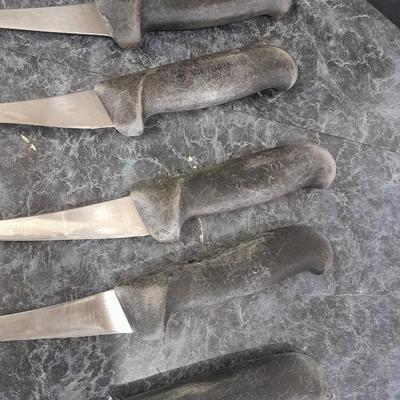 Charcoal Companion stainless steel grilling tool set and several filet knives.