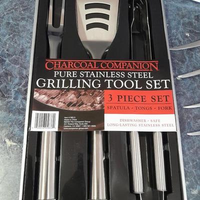 Charcoal Companion stainless steel grilling tool set and several filet knives.