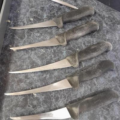 Charcoal Companion stainless steel grilling tool set and several filet knives.