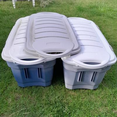 Two large Rubbermaid totes with 3 lids