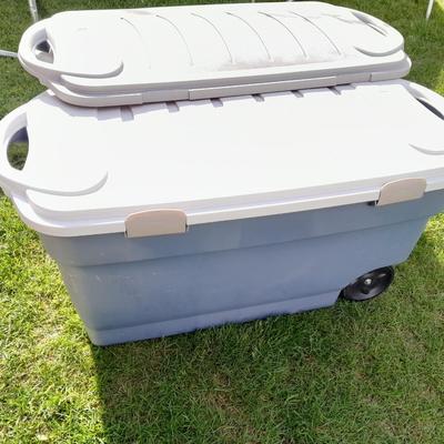 Two large Rubbermaid totes with 3 lids