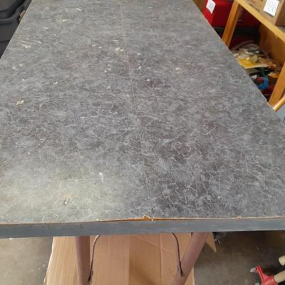 Small folding camper table with two metal chairs