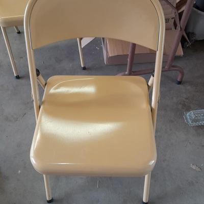 Small folding camper table with two metal chairs