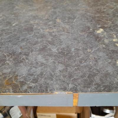 Small folding camper table with two metal chairs