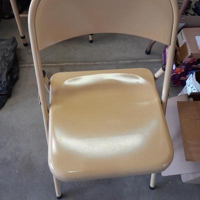 Small folding camper table with two metal chairs