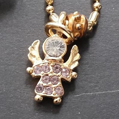 Fashion necklaces Birthstone angels, Turquoise and red colored Cross, and more