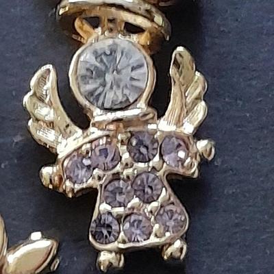 Fashion necklaces Birthstone angels, Turquoise and red colored Cross, and more