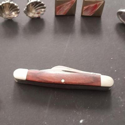 Men's cuff links pocketknife and necklace