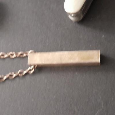 Men's cuff links pocketknife and necklace