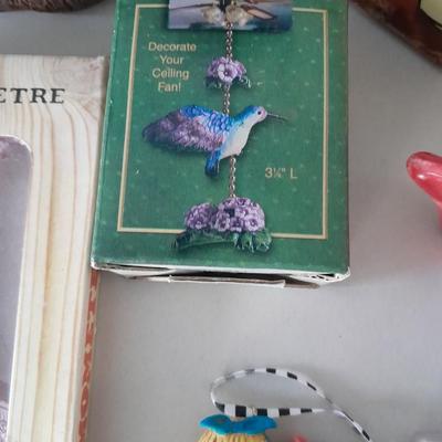 Small collectible thermometers, yard Squirrel, angel, Hummingbird fan pull and more