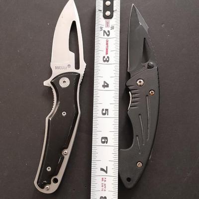 Two pocketknives and a belt sheath