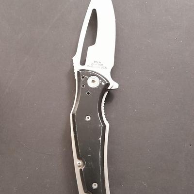 Two pocketknives and a belt sheath