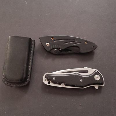 Two pocketknives and a belt sheath