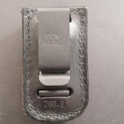 Two pocketknives and a belt sheath