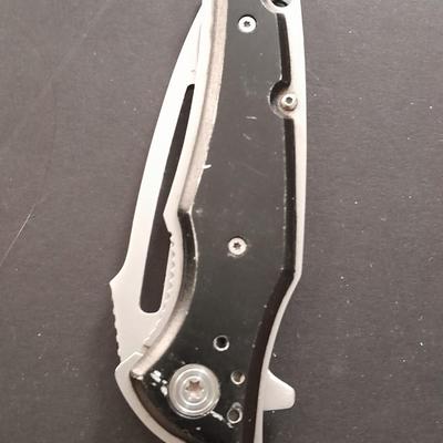 Two pocketknives and a belt sheath