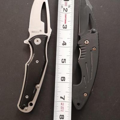 Two pocketknives and a belt sheath