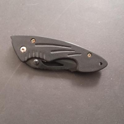 Two pocketknives and a belt sheath