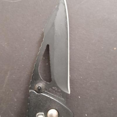 Two pocketknives and a belt sheath