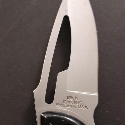 Two pocketknives and a belt sheath