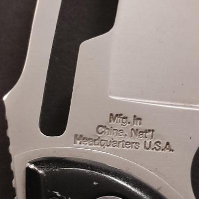 Two pocketknives and a belt sheath