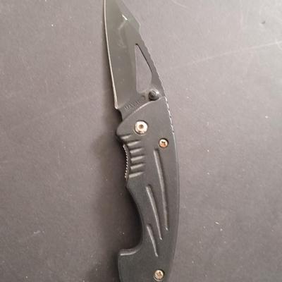 Two pocketknives and a belt sheath