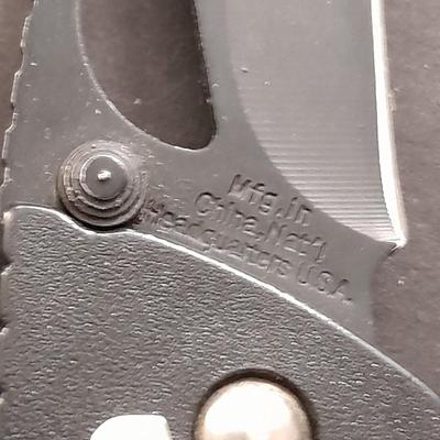 Two pocketknives and a belt sheath