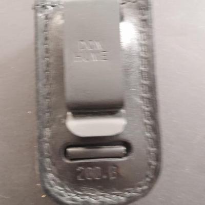 Two pocketknives and a belt sheath