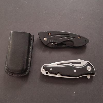 Two pocketknives and a belt sheath