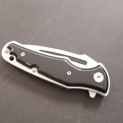 Two pocketknives and a belt sheath