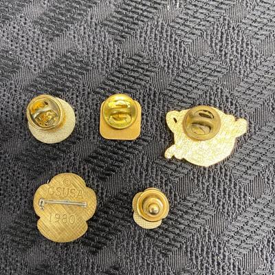 Assorted club pins