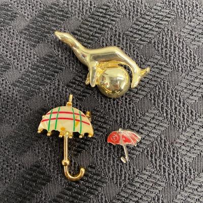 Gold seal and umbrellas
