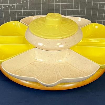 Lazy Susan with Yellow and off White Ceramic Dishes.